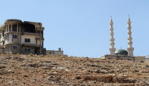 Damage is seen on a building and a mosque from the fighting between Lebanese army soldiers and Islamist militants, in the Sunni Muslim border town of Arsal, in eastern Bekaa Valley